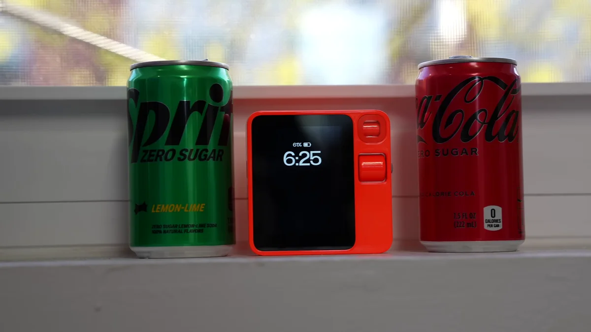 Rabbit R1 handheld AI device in orange