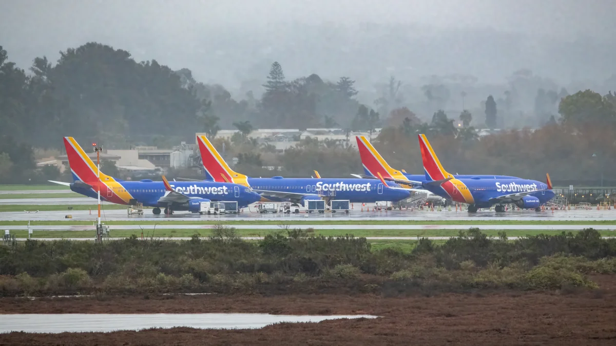Multiple Southwest Airlines Boeing 737 aircraft on the ground at Santa Barbara Airport — Southwest operates an all-737 fleet on a point-to-point network that proved uniquely vulnerable to cascading scheduling failures during Winter Storm Elliott in December 2022